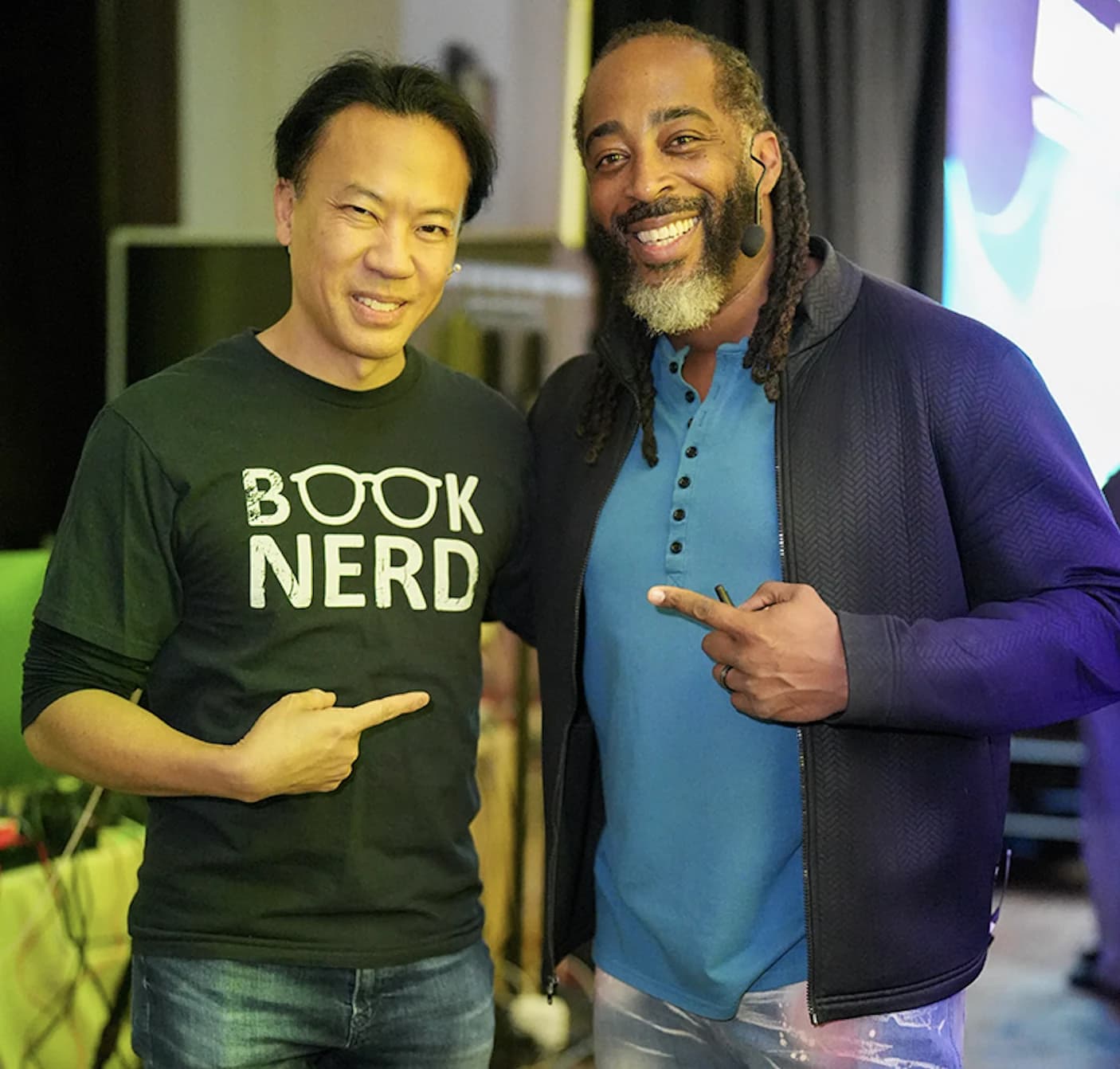 Jim Kwik with a speaker at Limitless Live